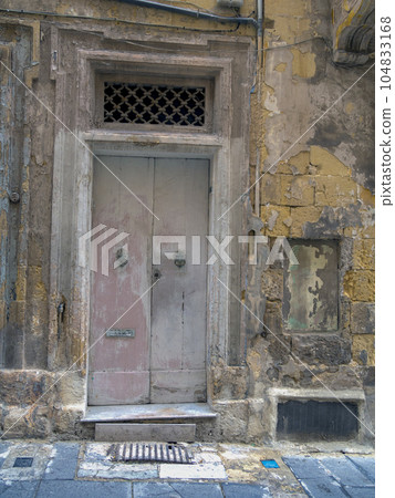 close up retro style old house door of Mediterranean architectural culture in Mediterranean island close up retro style old house door of Mediterranean architectural culture in Mediterranean island 104833168