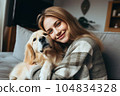 Cheerful woman hugging her beloved pet dog at home . Generative AI 104834328