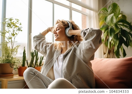 Cheerful woman listening to music and dancing. Generative AI Cheerful woman listening to music and dancing. Generative AI 104834333