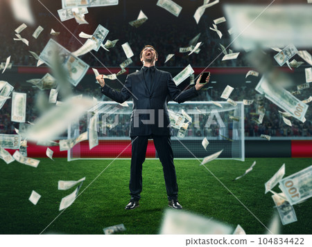 Emotional, lucky, excited businessman feeling success and win of many money on sports betting. 3D arena background 104834422