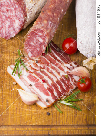 Various Smoked sausage with rosemary and peppercorns tomatoes and garlic 104834659