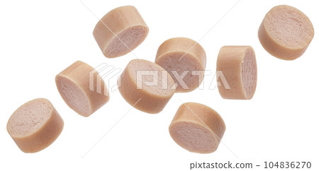 Fallings sausage slices isolated on white background Fallings sausage slices isolated on white background 104836270