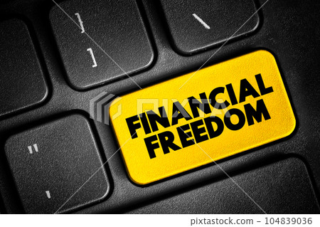 Financial freedom - having enough savings, financial investments, and cash on hand to afford the kind of life we desire for our families, text button on keyboard 104839036