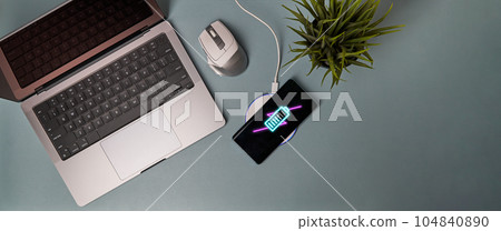 Charging mobile phone battery with wireless charging device on the table. 104840890