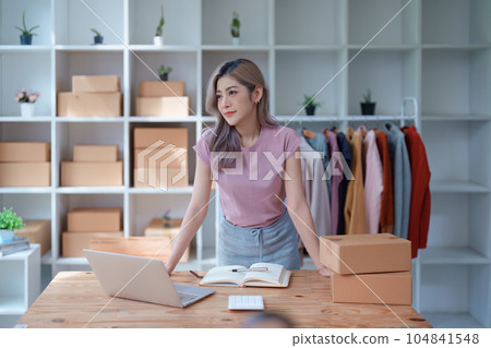 Portrait Of Asian Female Owner Of Fashion Store Clothing Store successful happy smile at small business, sme or ecommerce concepts. Portrait Of Asian Female Owner Of Fashion Store Clothing Store successful happy smile at small business, sme or ecommerce concepts. 104841548