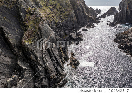 Aerial view of the coastline at Malin Head in Ireland. 104842847