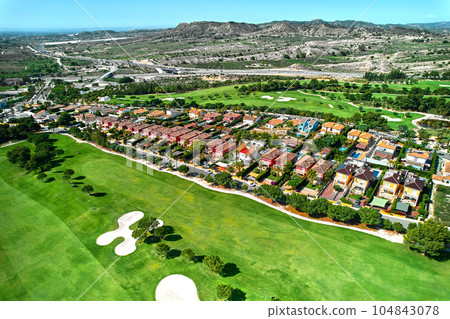 Drone point of view golf course during sunny summer day 104843078