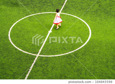 children playing during breaktime in the school football field children playing during breaktime in the school football field 104843599