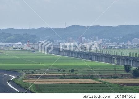 Tohoku Shinkansen going through the countryside, Ichinoseki 104844592