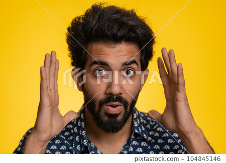 Excited amazed man surprise looking at camera with big eyes, shocked by sudden victory wow emotion Excited amazed man surprise looking at camera with big eyes, shocked by sudden victory wow emotion 104845146