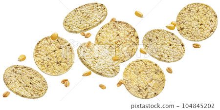 Corn biscuits, puffed rice and corn cakes isolated on white background Corn biscuits, puffed rice and corn cakes isolated on white background 104845202