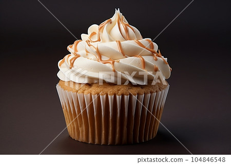 Vanilla cupcake with cream and caramel 104846548