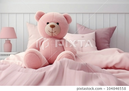 Teddy bear sitting on the bed 104846558