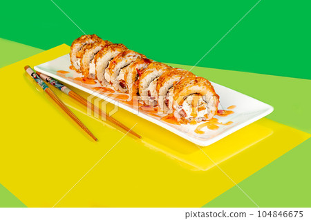 Sushi sets, rolls with caviar, shrimp, tuna and avocado and Philadelphia cheese, on a white plate. Sushi sets, rolls with caviar, shrimp, tuna and avocado and Philadelphia cheese, on a white plate. 104846675