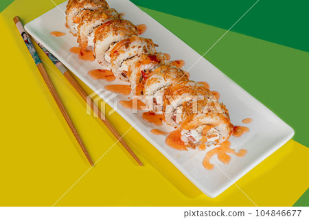 Sushi sets, rolls with caviar, shrimp, tuna and avocado and Philadelphia cheese, on a white plate. Sushi sets, rolls with caviar, shrimp, tuna and avocado and Philadelphia cheese, on a white plate. 104846677