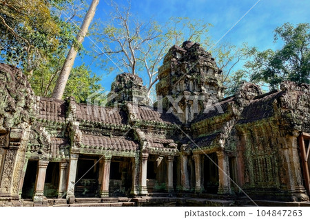 Photo of the crumbling ruins of the famous Khmer temple of Ta Prohm, a prominent tourist attraction in Cambodia. 104847263