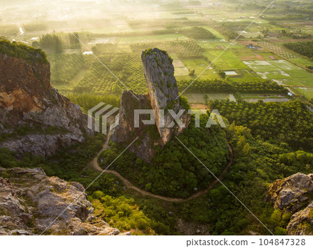 Aerial view of Khao Kuha mountain hill at sunrise, Songkhla Aerial view of Khao Kuha mountain hill at sunrise, Songkhla 104847328