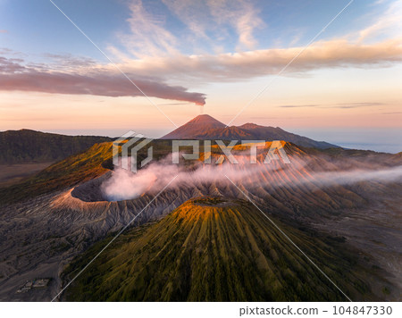Aerial view Mount Bromo active volcano at sunrise, East Java, Indonesia Aerial view Mount Bromo active volcano at sunrise, East Java, Indonesia 104847330