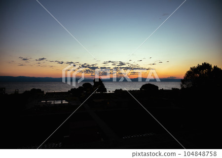 First Rays Of Sun Are Reflected In The Mountains Of Balkan Peninsula, Corfu. Concept Of sleep-wake cycle and Human Health. First Rays Of Sun Are Reflected In The Mountains Of Balkan Peninsula, Corfu. Concept Of sleep-wake cycle and Human Health. 104848758