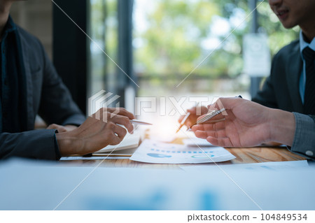 startup business, business advisor explaining strategy for planning finance investment teamwork paperwork audit and discussing marketing, profit, budget of company in meeting room startup business, business advisor explaining strategy for planning finance investment teamwork paperwork audit and discussing marketing, profit, budget of company in meeting room 104849534