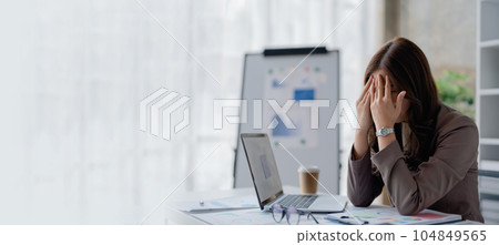Portrait of sme business owner, woman using computer and financial statements Anxious expression on expanding the market to increase the ability to invest in business. 104849565
