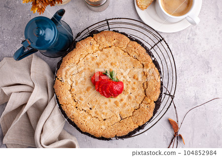 Tollhouse pie decorated with strawberries 104852984