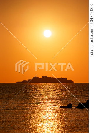 Gunkanjima and the setting sun Nagasaki World Heritage 104854068