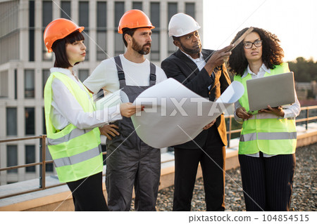 Industrial employees working on remodeling business center Industrial employees working on remodeling business center 104854515