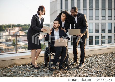 Professionals analyzing new project via modern technologies Professionals analyzing new project via modern technologies 104854765