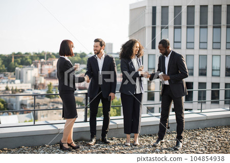 Diverse investors shaking hands and agreeing for partnership Diverse investors shaking hands and agreeing for partnership 104854938