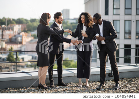 Diverse investors shaking hands and agreeing for partnership Diverse investors shaking hands and agreeing for partnership 104854941