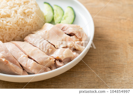 Hainanese chicken rice or rice steamed with chicken soup Hainanese chicken rice or rice steamed with chicken soup 104854997