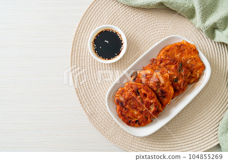 Korean Kimchi pancake or Kimchijeon - Fried Mixed Egg, Kimchi, and Flour 104855269