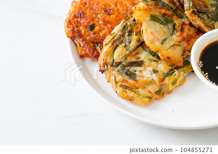 Pajeon or Korean pancake and Korean Kimchi pancake or Kimchijeon on white background 104855271