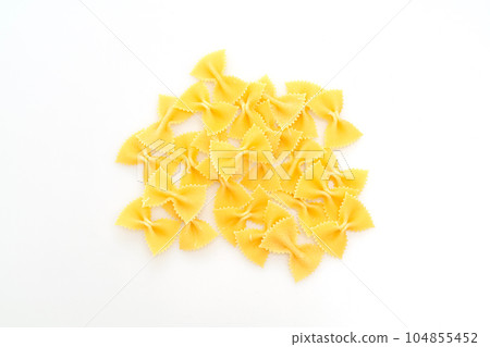 Dry uncooked farfalle pasta on white background Dry uncooked farfalle pasta on white background 104855452