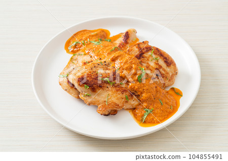 grilled chicken steak with red curry sauce grilled chicken steak with red curry sauce 104855491