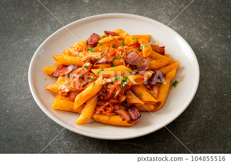 stir-fried penne pasta with kimchi and bacon stir-fried penne pasta with kimchi and bacon 104855516