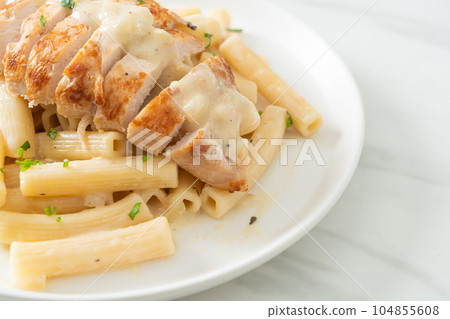 quadrotto penne pasta white creamy sauce with grilled chicken 104855608