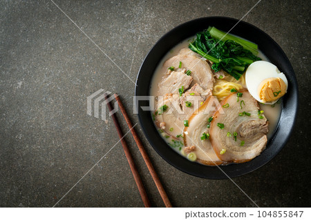 Ramen noodles in pork bone soup with roast pork and egg 104855847