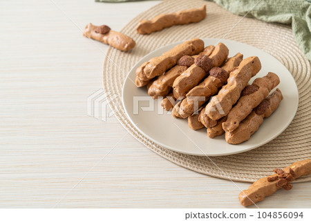 chocolate meringue stick on plate 104856094