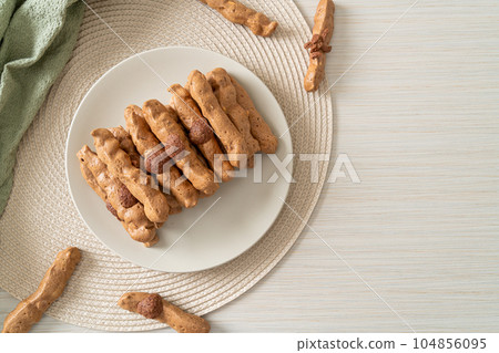 chocolate meringue stick on plate 104856095