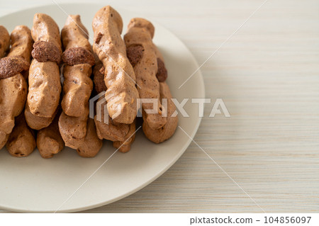 chocolate meringue stick on plate chocolate meringue stick on plate 104856097