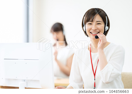 Operator working in a call center Operator working in a call center 104856663
