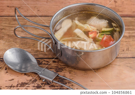 Outdoor cuisine chicken and vegetable soup Outdoor cuisine chicken and vegetable soup 104856861