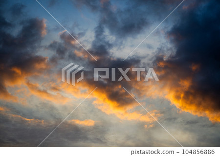 Sky transitioning from light blue to a deep orange Sky transitioning from light blue to a deep orange 104856886