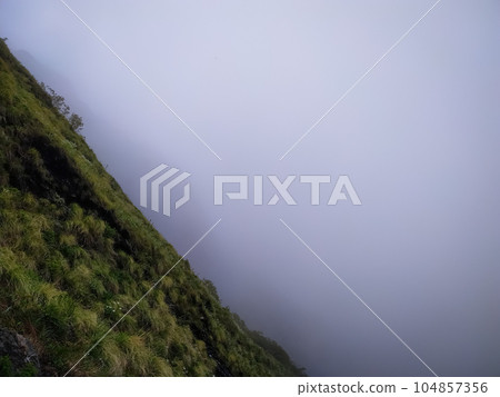 Beautiful landscape of foggy mountain 104857356