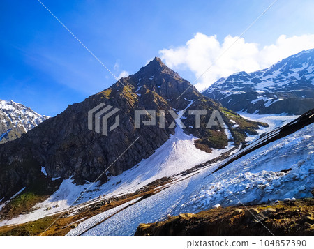 Beautiful mountain landscape with snow and clear blue sky Beautiful mountain landscape with snow and clear blue sky 104857390