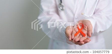 Orange Ribbon for Leukemia, Kidney cancer day, world Multiple Sclerosis, CRPS, Self Injury Awareness month. Healthcare and word cancer day concept 104857779