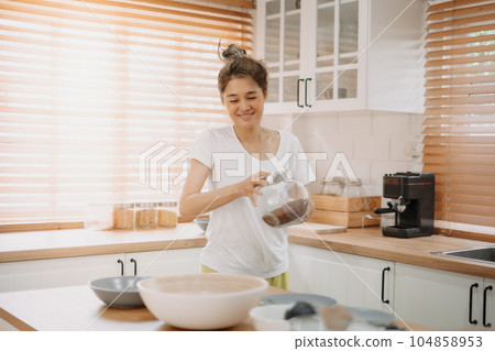 Funny candid moment of wife cooking for husband for the first time. 104858953