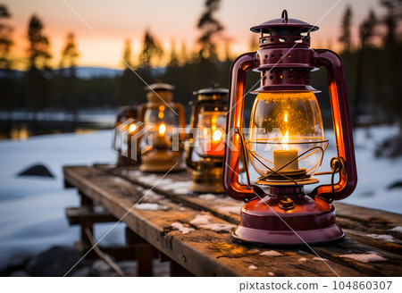 Lantern with burning candles on a wooden pier in the forest Lantern with burning candles on a wooden pier in the forest 104860307